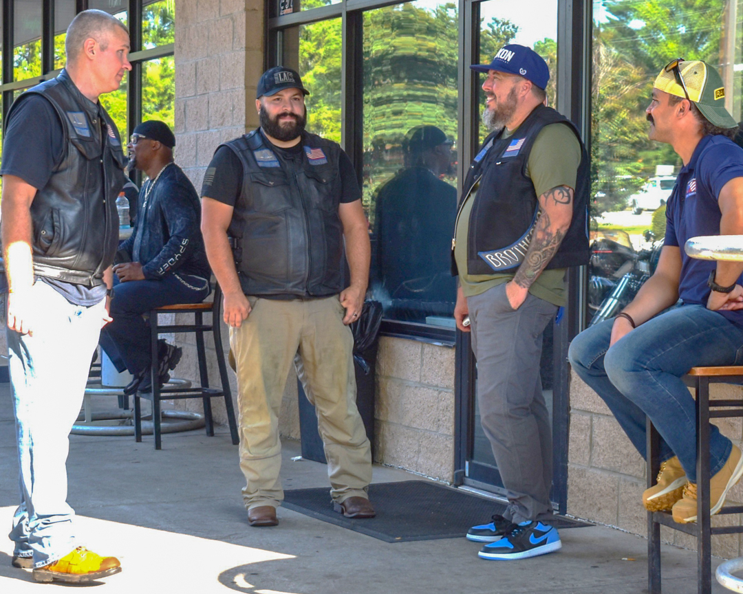 SCDVA Upstate Pathfinder Manager Tito Vazquez, right, speaks with other riders from the 7th Annual Honor Ride & Car Show.