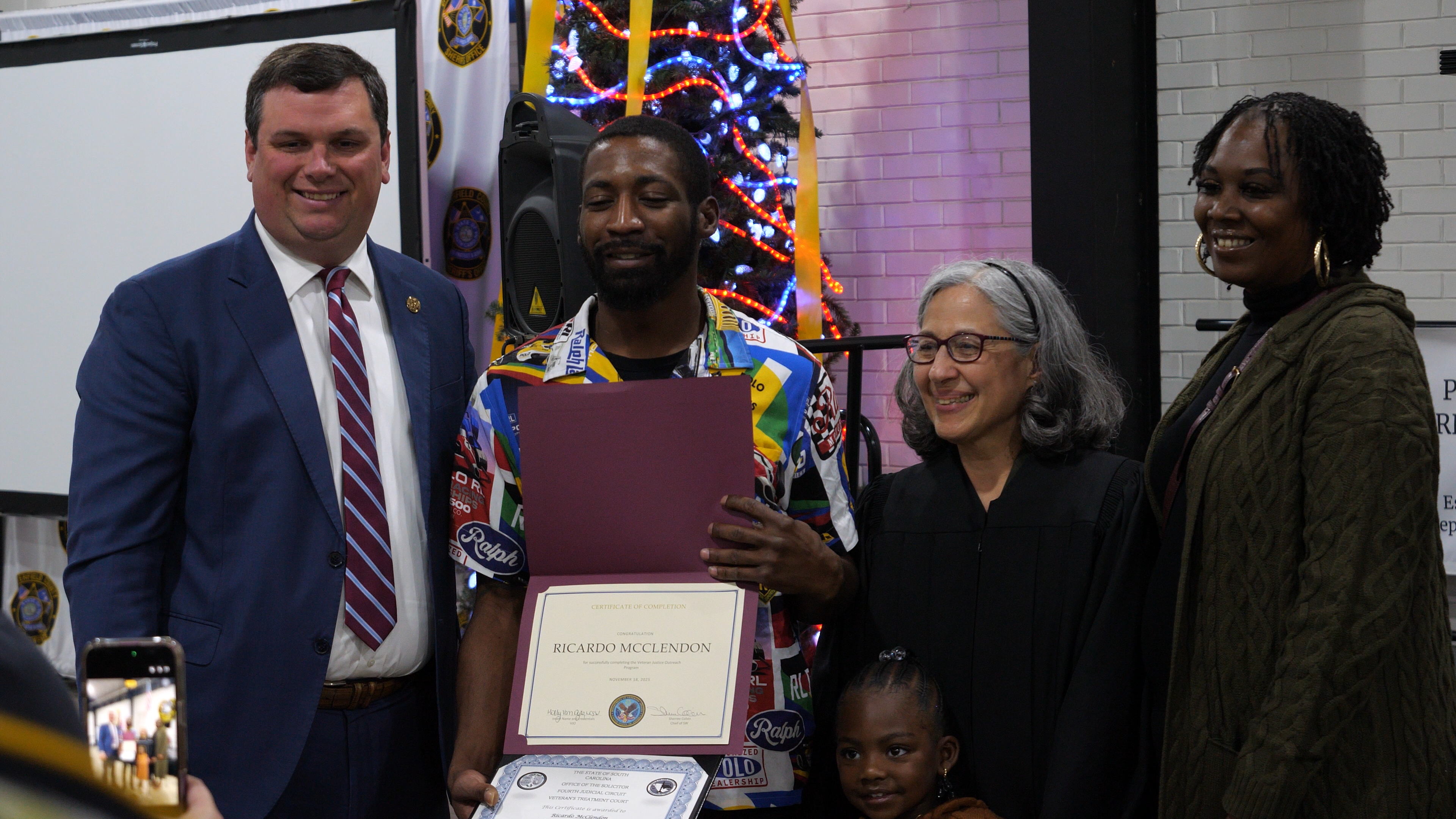 Chesterfield Graduate Ricardo Poses with Family 