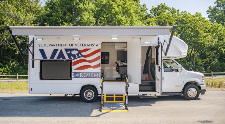SCDVA white mobile services van with SCDVA logo on side
