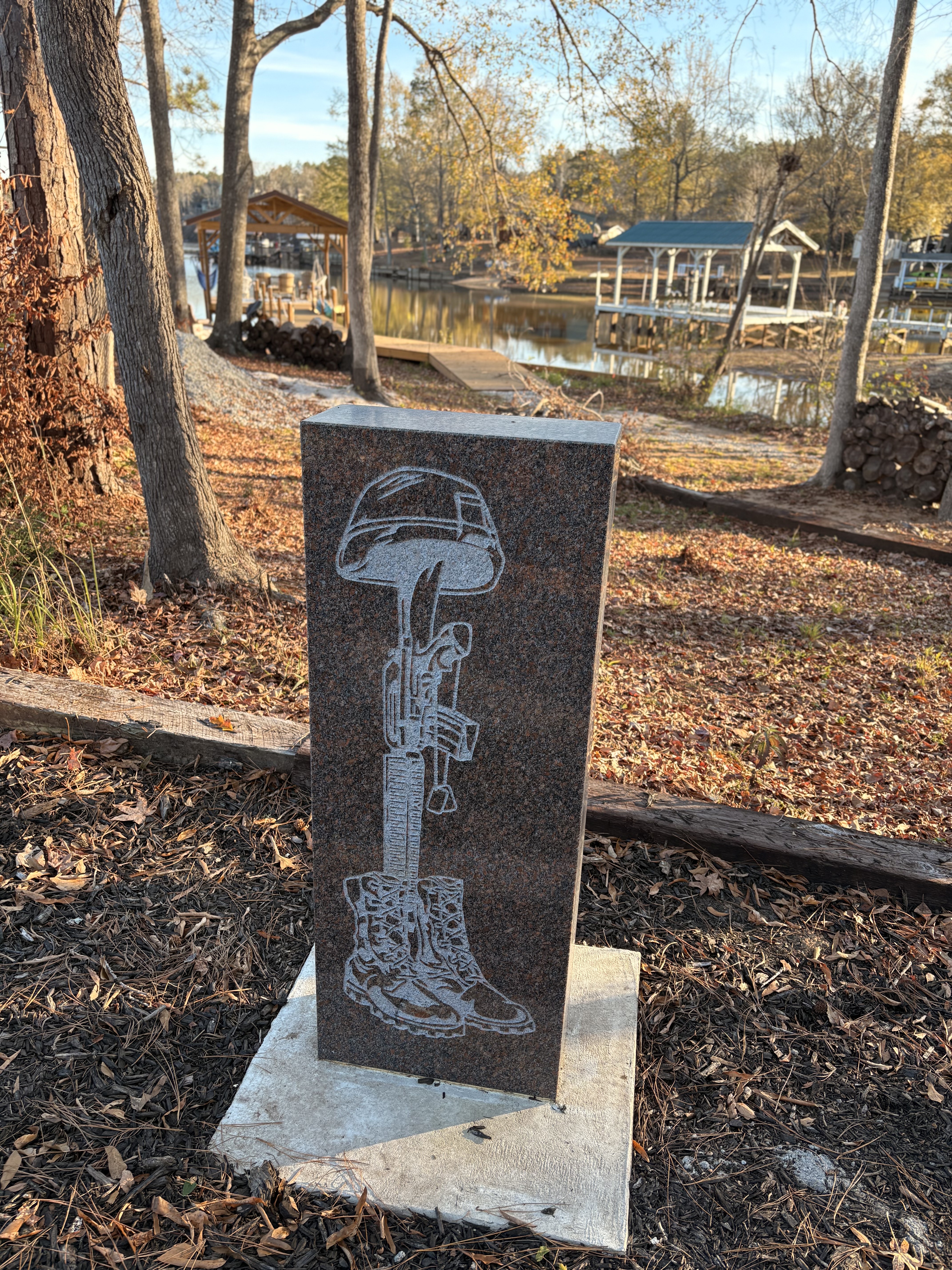 photo of etched stone near lake
